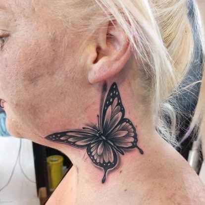 Black and grey butterfly covering it, after